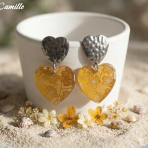 camille-boucles-cœurs-fleuris L'éclat de l'acier rencontre la douceur du papier Washi dans un duo de cœurs solaires