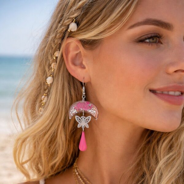 "Finitions de l'envers des boucles Pauline : acier inoxydable argent lisse et résine brillante pour un fini professionnel."